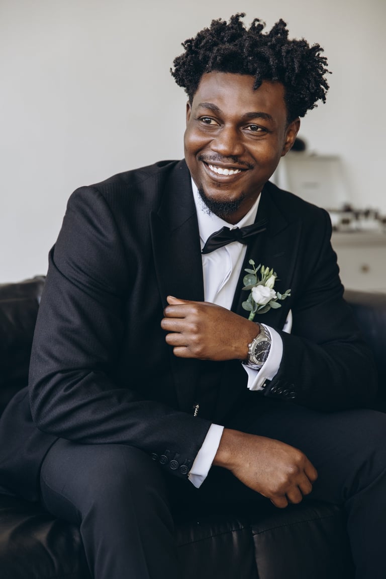 Smiling groom in elegant suit